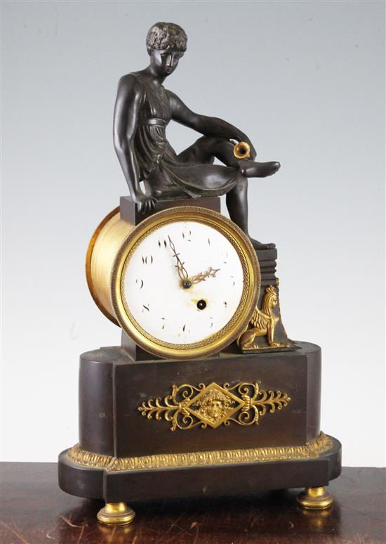 A French Empire bronze and ormolu mantel timepiece, 15.5in.